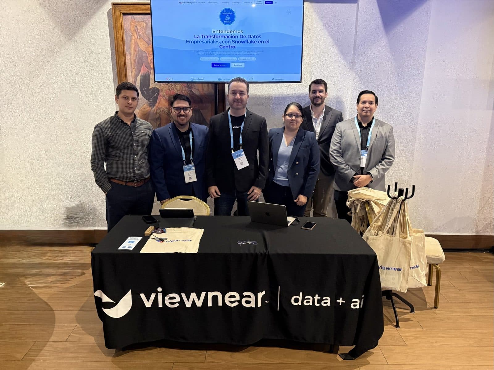 The Viewnear team behind their data + ai booth at a Snowflake event